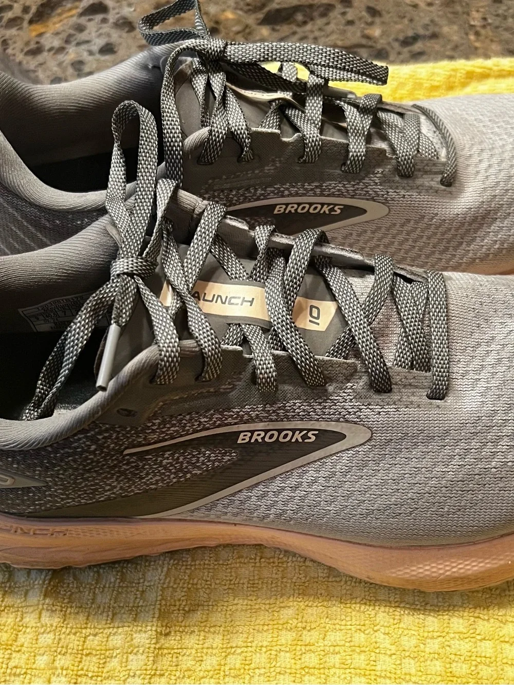Brooks gray running shoes with pinkish peach midsole